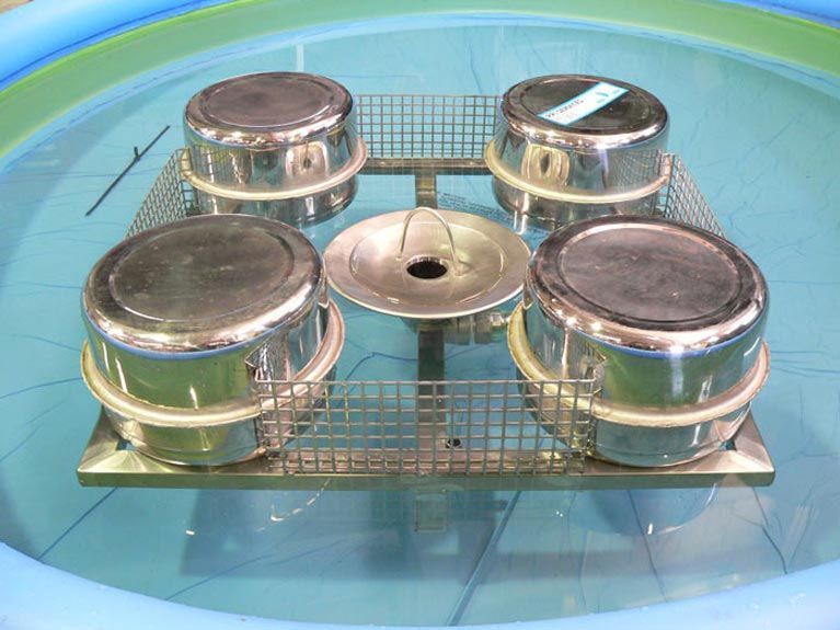 A bunch of pots are sitting in a pool of water