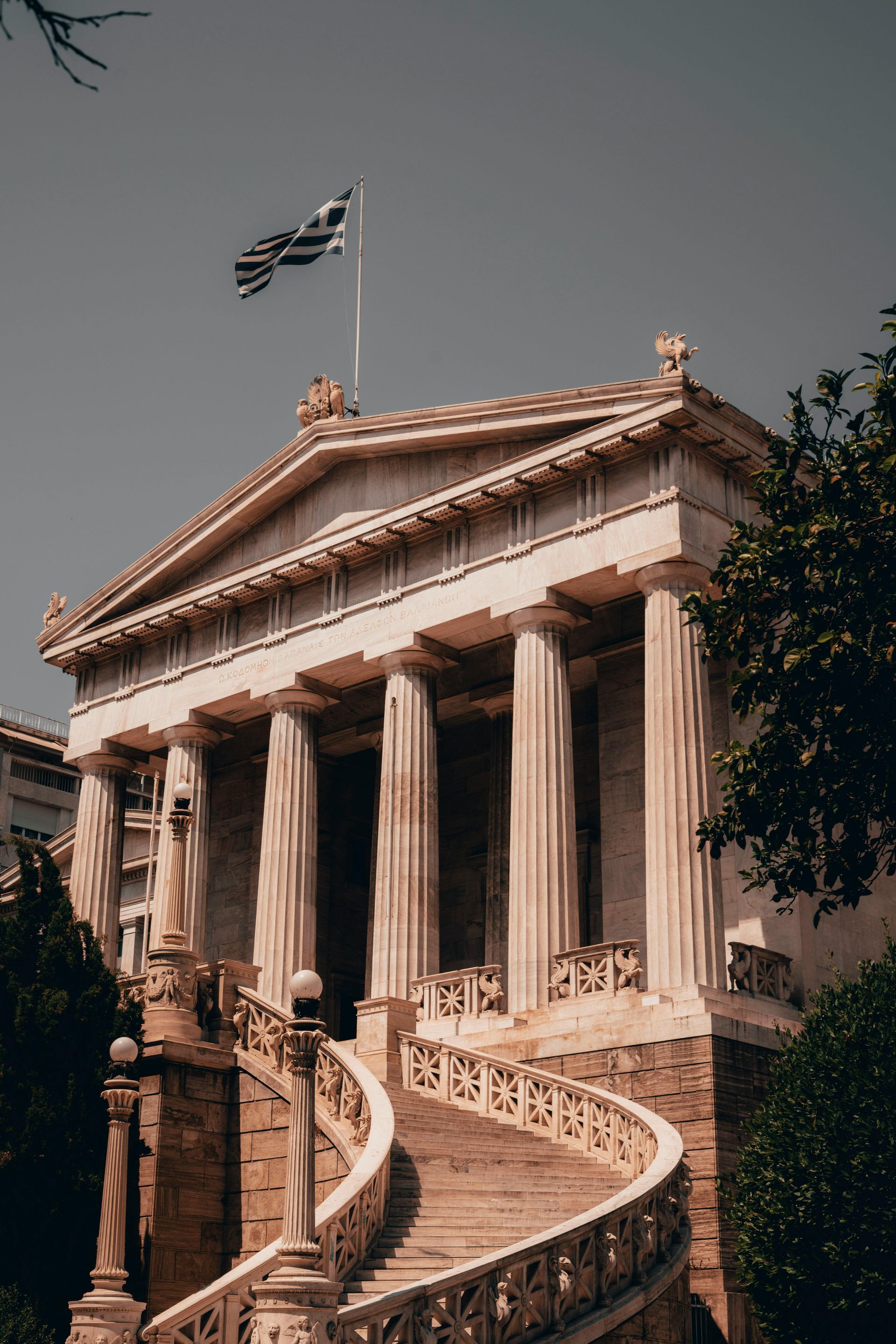 A large building with columns and stairs leading up to it.