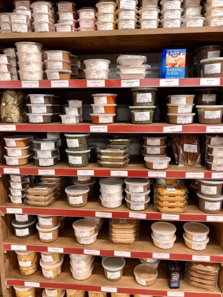 A store shelf filled with lots of different types of food