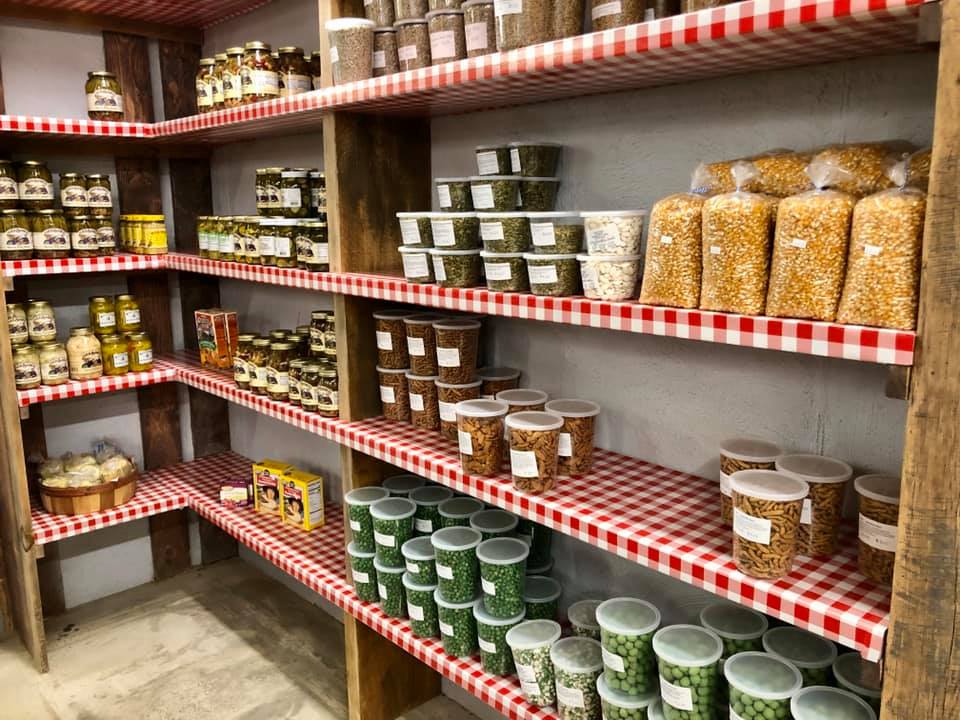 A store filled with shelves filled with lots of food.