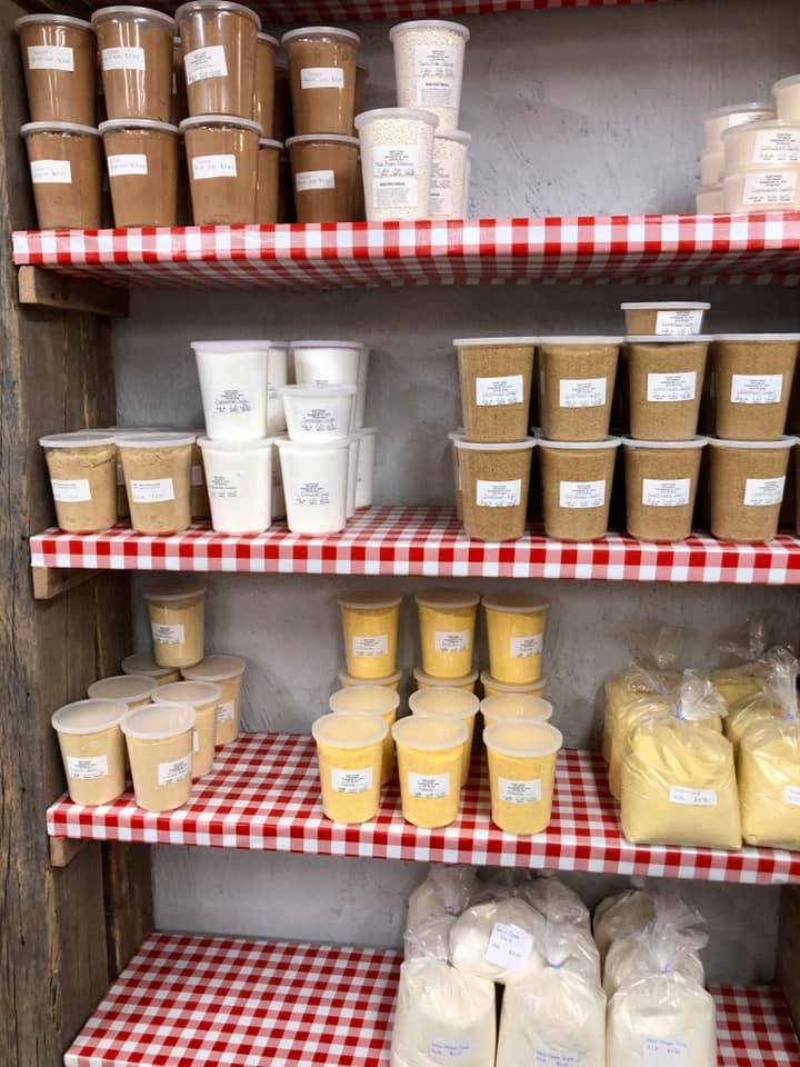 A shelf filled with many different types of food