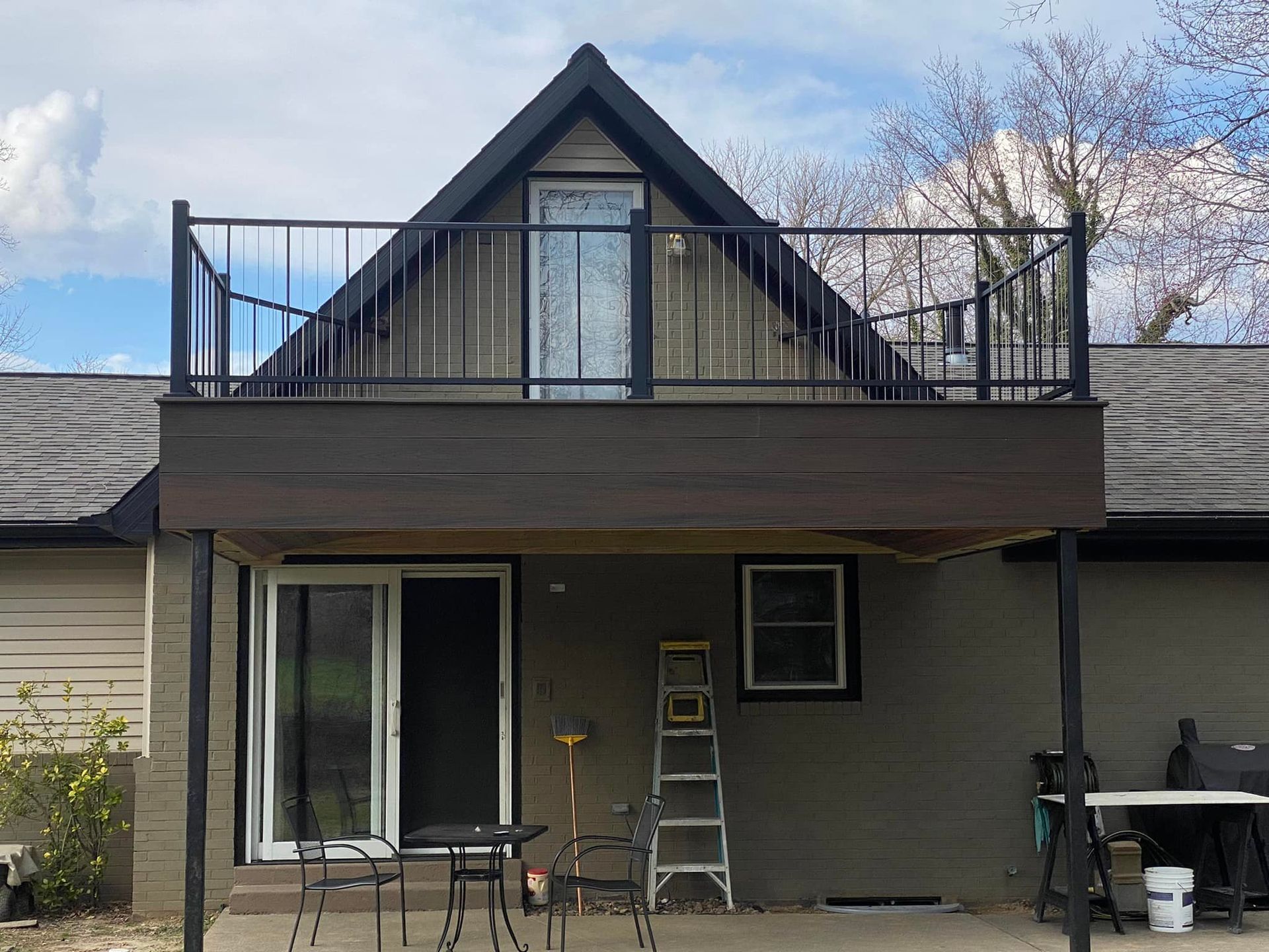 A house with a balcony on top of it
