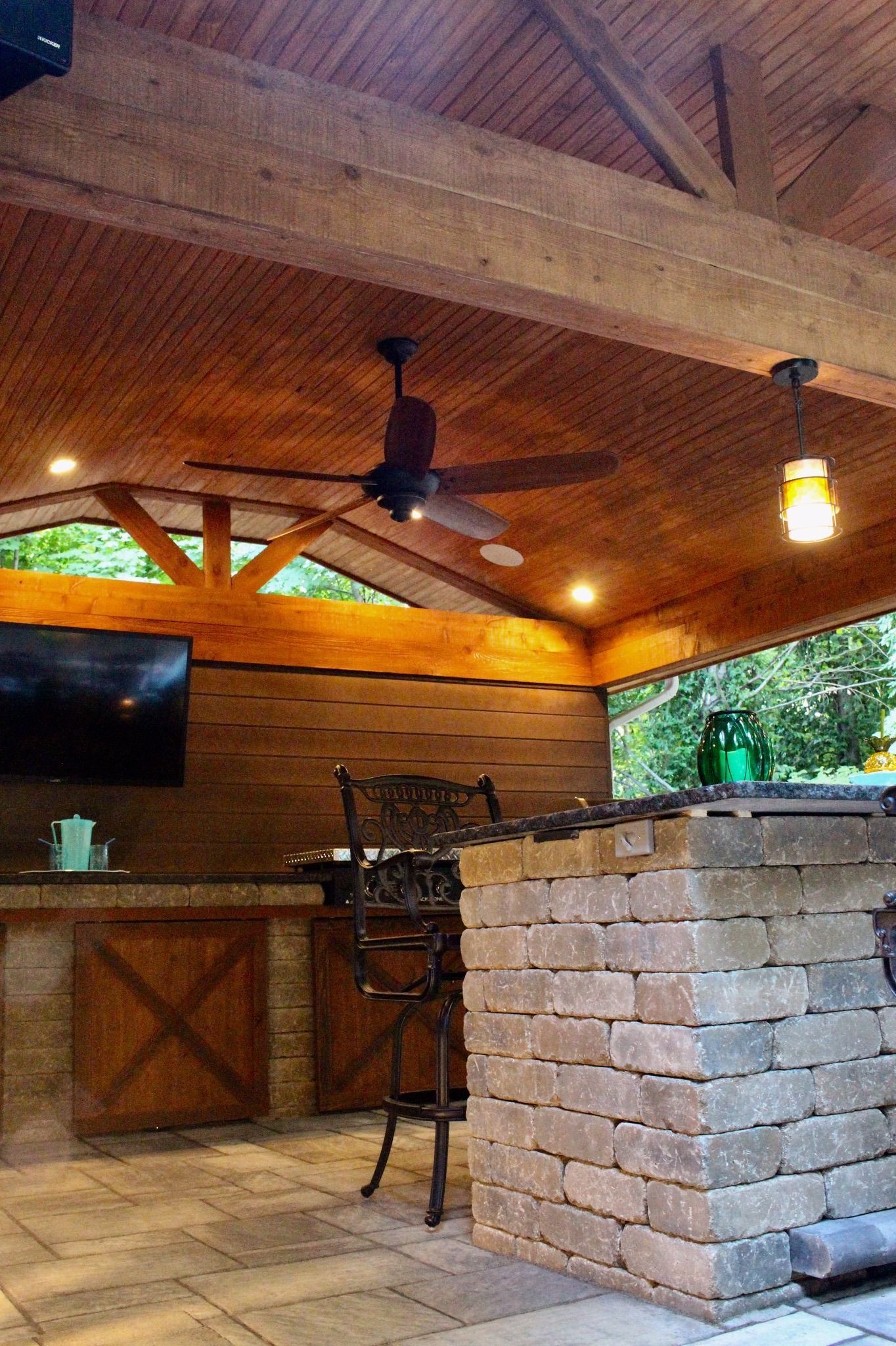 There is a ceiling fan hanging from the ceiling of the room.