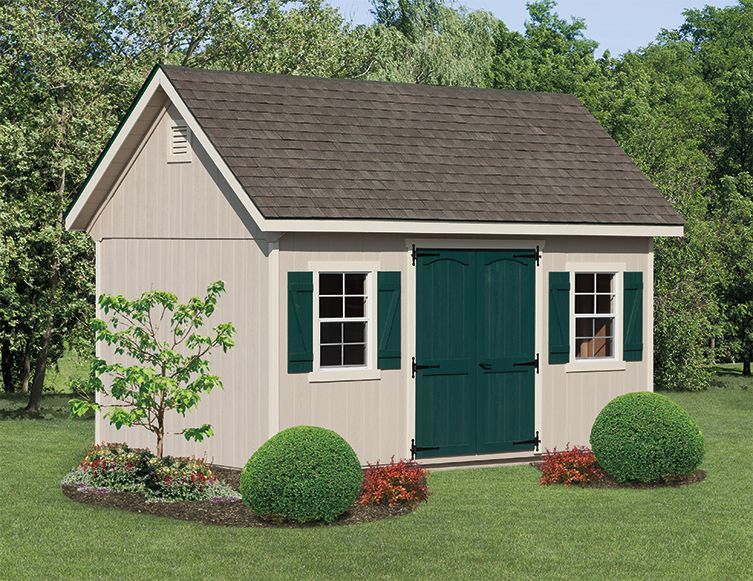 classic garden cottage with tan siding and green door