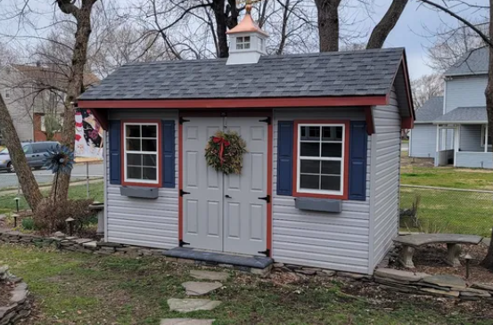 blue garden quaker shed with blue and red trim