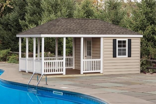 hip roof cabana with tan siding and white porch area