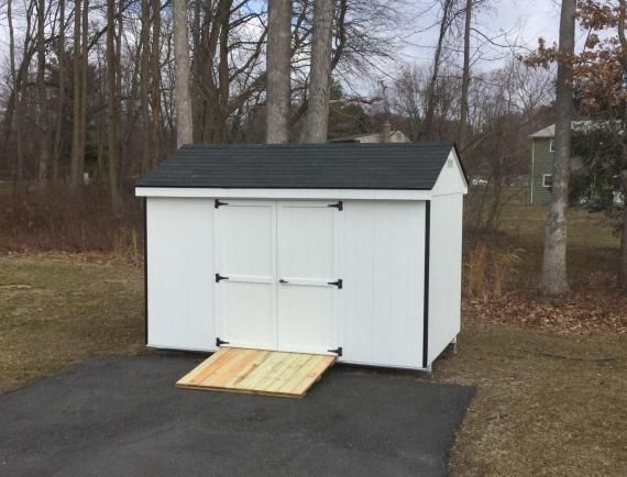 white economy cottage shed with ramp