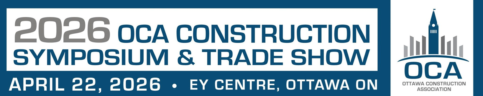 Two people in safety vests and hard hats looking at a tablet outdoors.