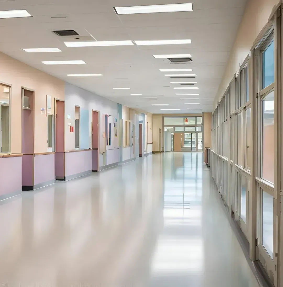 A long hallway with a lot of windows and doors