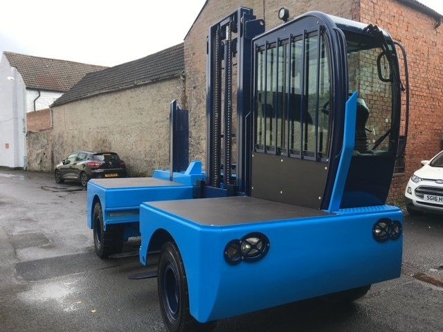 Blue side loader from rear