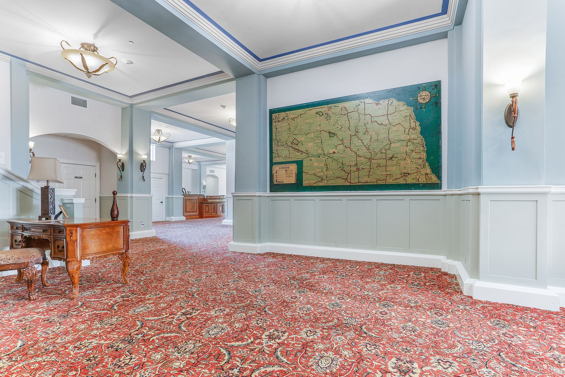 There is a large map on the wall in the middle of the room.
