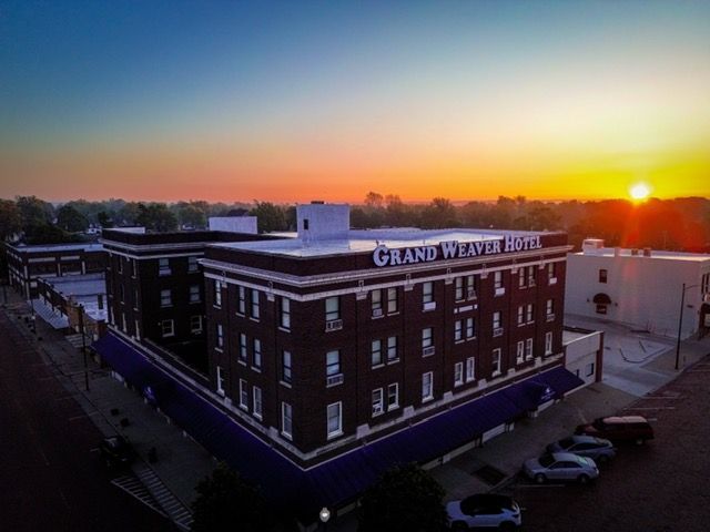 An aerial view of the grand western hotel at sunset.