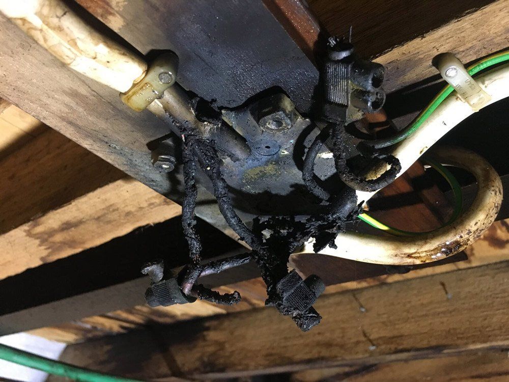 Lots of burnt wires on a ceiling — DG Electrical & Fire In Kiama, NSW