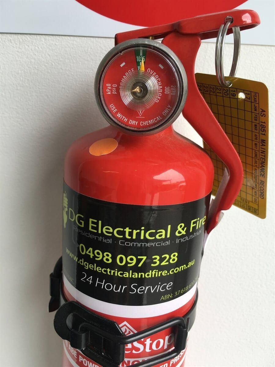 A Red Fire Extinguisher That Says Dg Electrical & Fire On It — DG Electrical & Fire In Kiama, NSW