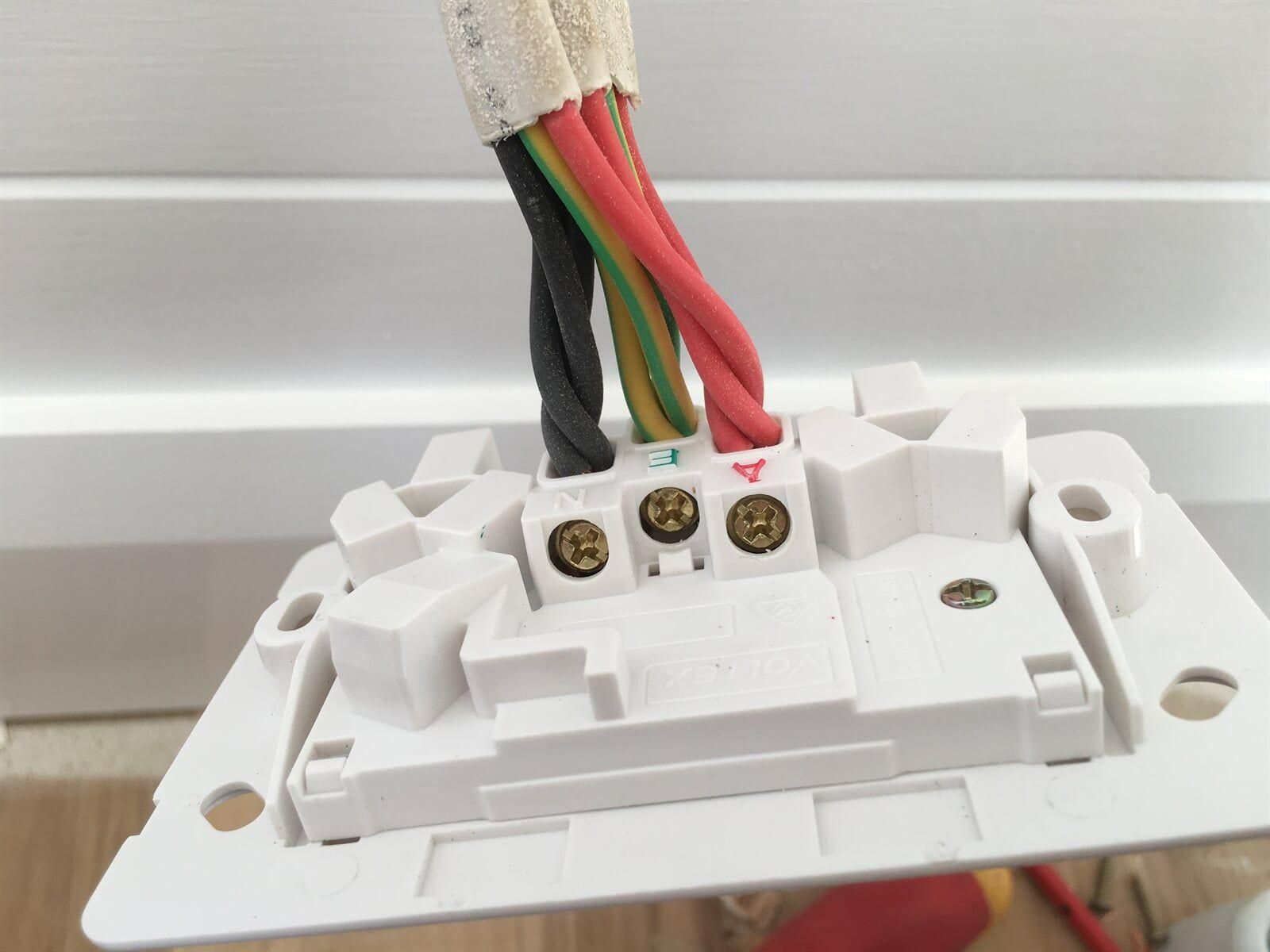 A Close Up Of A Light Switch With Wires Connected To It — DG Electrical & Fire In Kiama, NSW