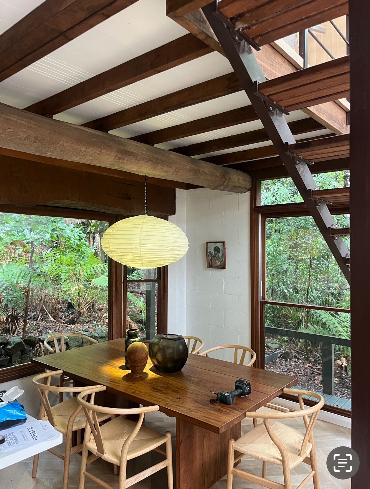 Dining Room With Wooden Table, Chairs, and Paper Lantern — DG Electrical & Fire In Kiama, NSW