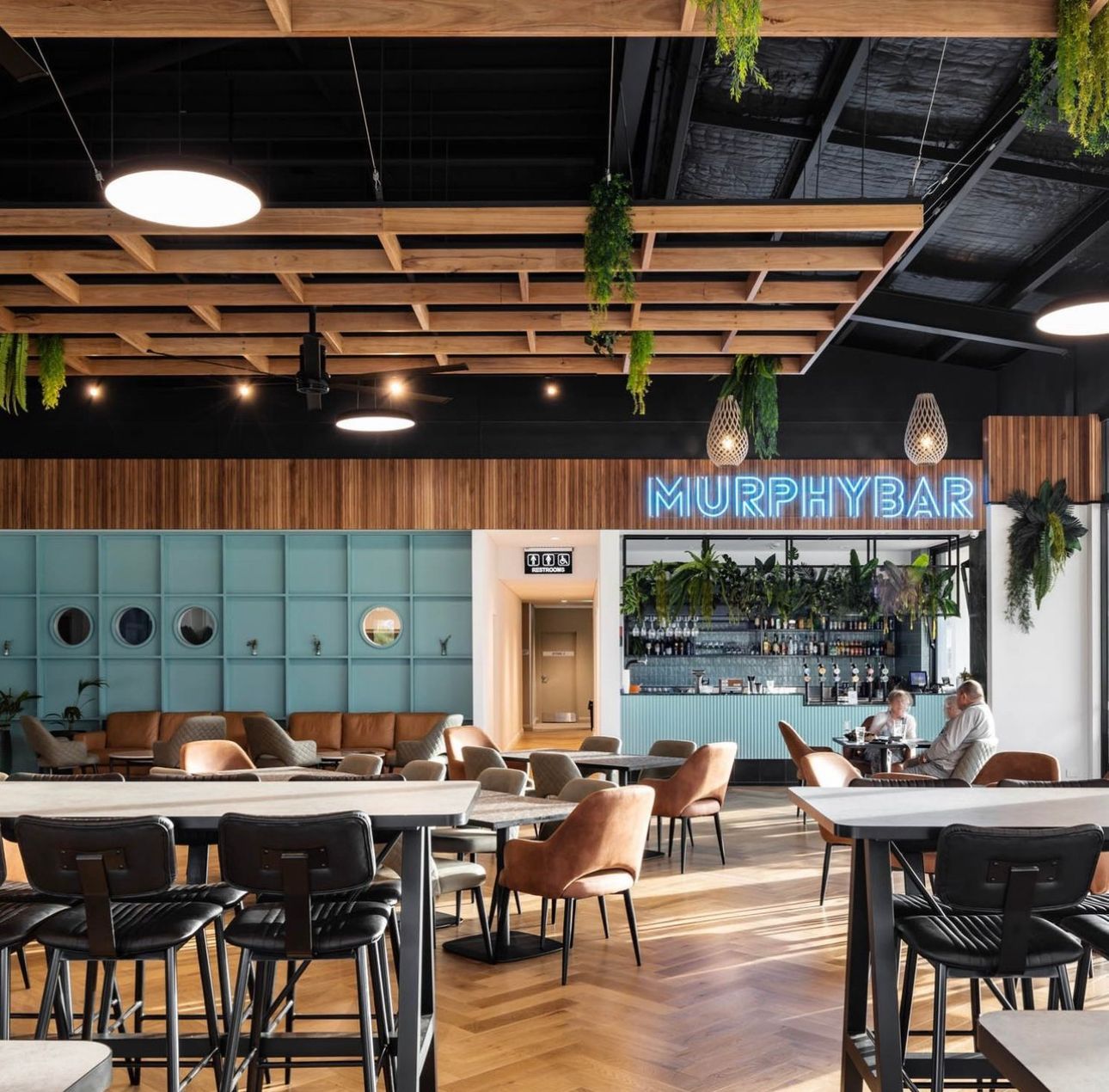 Interior of Murphy Bar With Tables, Bar, and Patrons — DG Electrical & Fire In Kiama, NSW