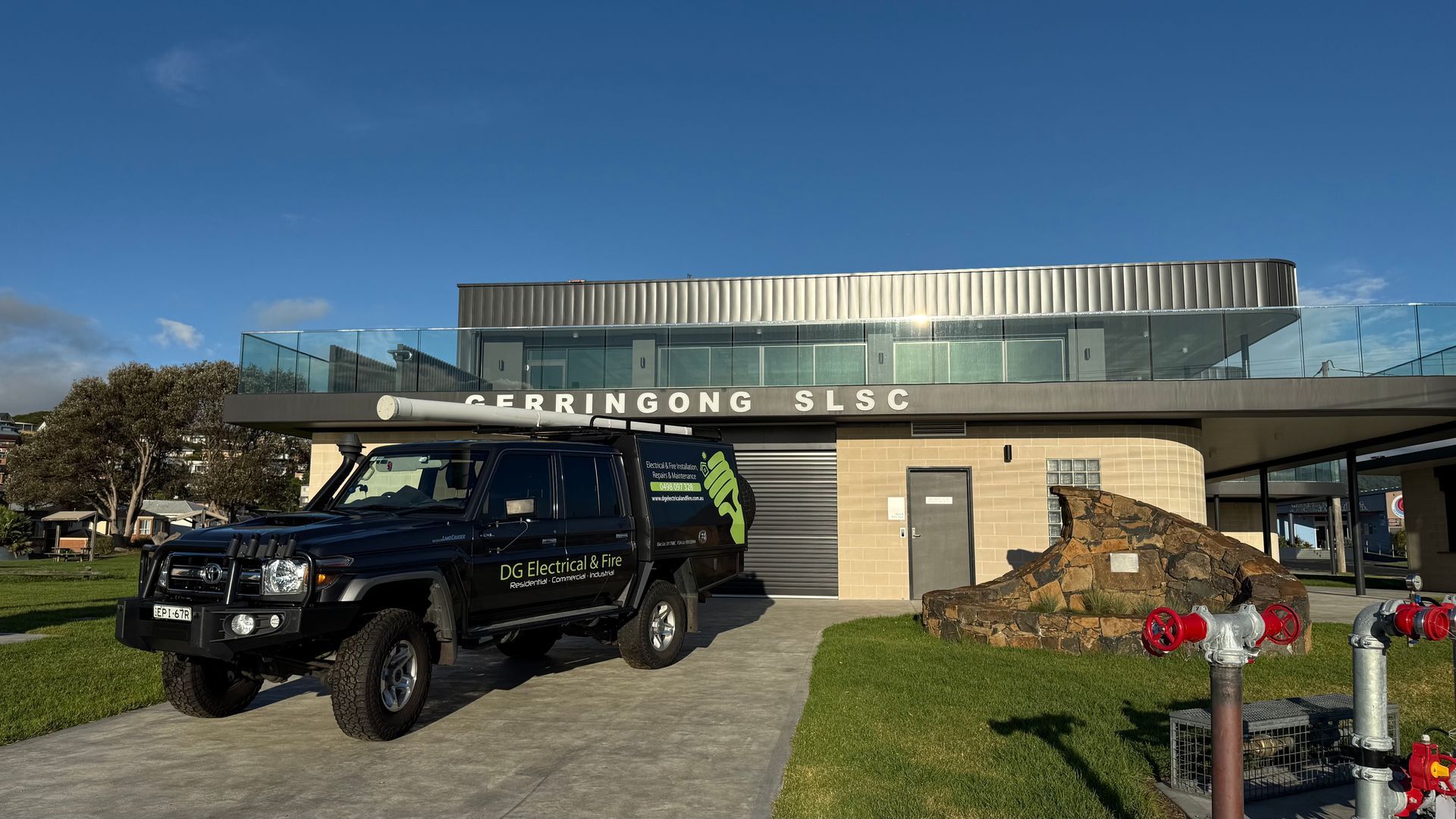 A Ceiling Fan Is Hanging From The Ceiling Of A Room — DG Electrical & Fire In Kiama, NSW