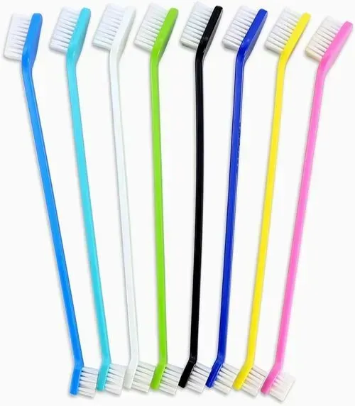 A bunch of different colored toothbrushes on a white background.