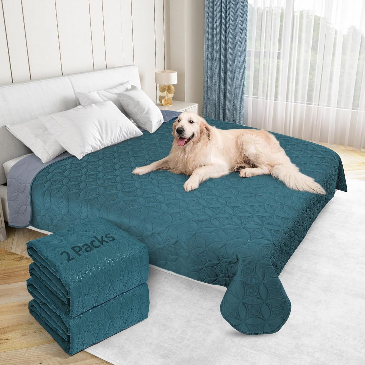 A dog is laying on a blue blanket on a bed