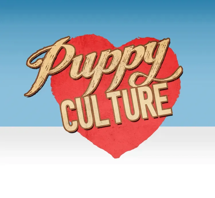 A red heart with the words puppy culture on it