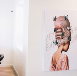 Woman with pink bouffant, butterfly art. 
