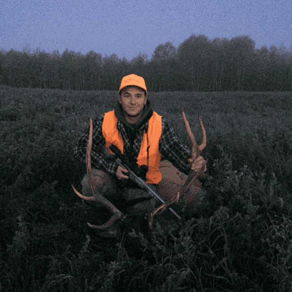 Photo of a teen hunter showing off his dead deer