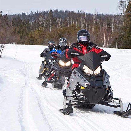 A convoy of snowmobiles