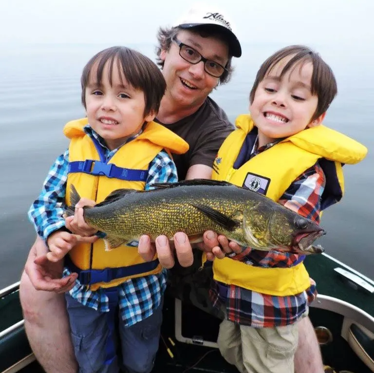 Kids and dad with fish