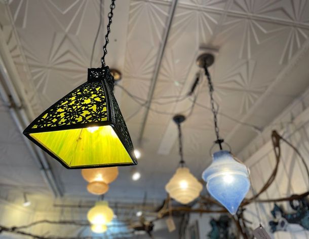 A ceiling with a few lights hanging from it