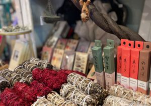 A bunch of incense sticks are sitting on top of each other on a table.