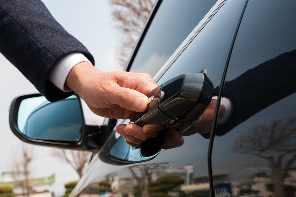 Close-up of male hand holding the car door/door for automotive/Car smart key