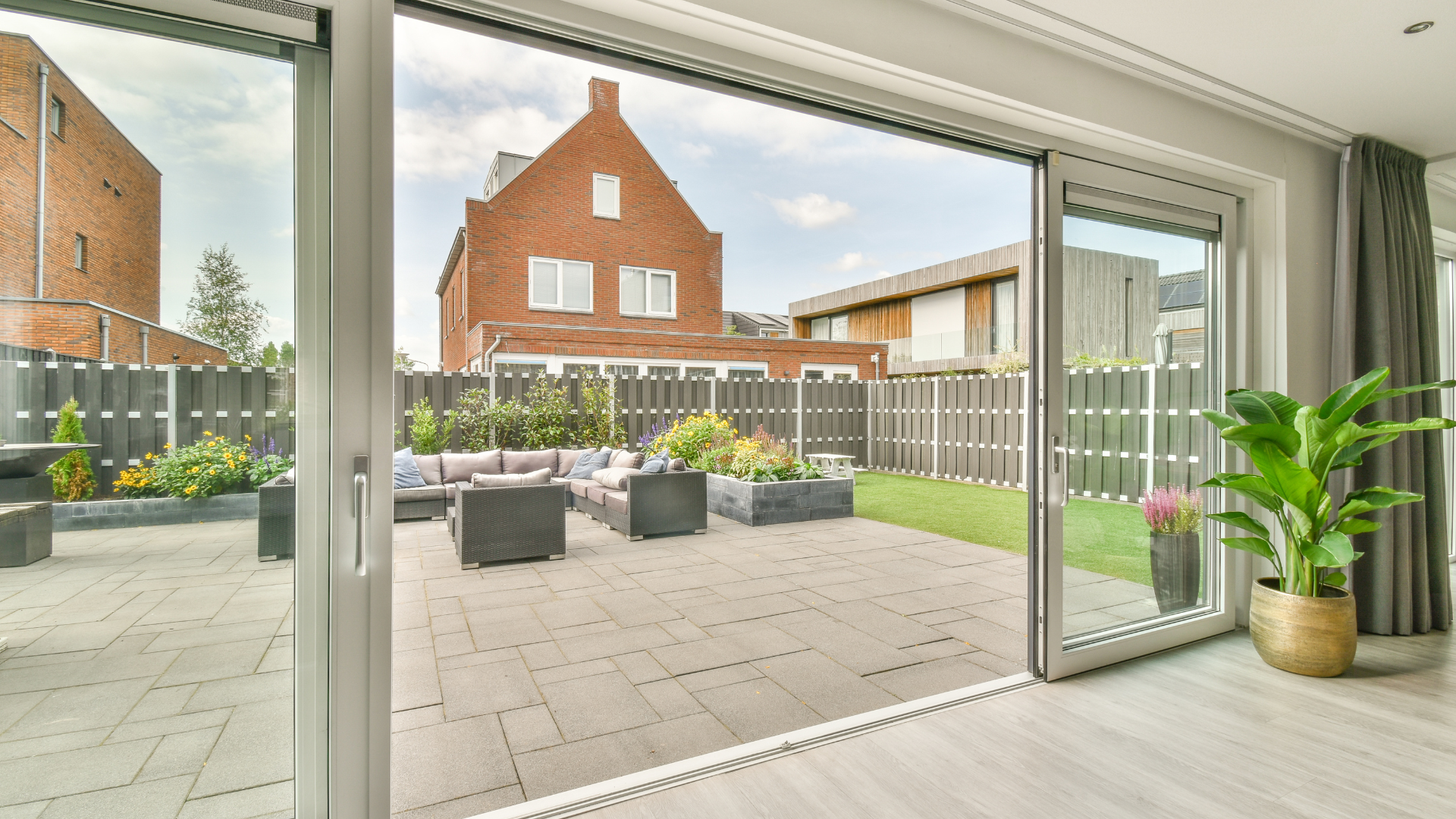 A living room with a sliding glass door leading to a patio.