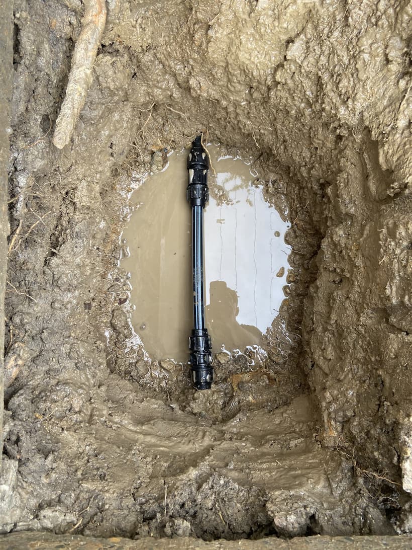 Water Pipeline Buried Under the Mud — Rossi Plumbing in Gold Coast, QLD