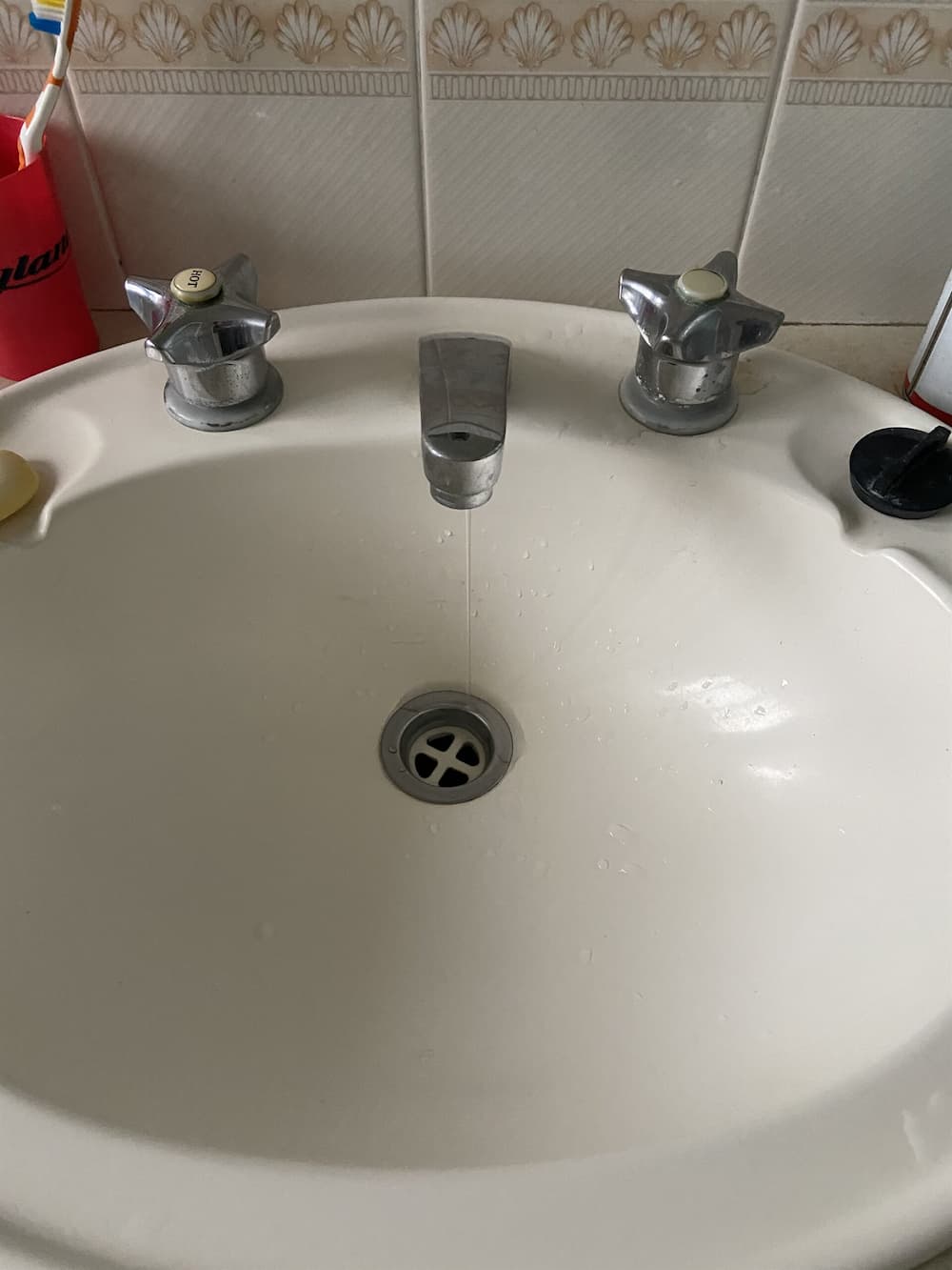 Leaking Tap in the Bathroom — Rossi Plumbing in Gold Coast, QLD