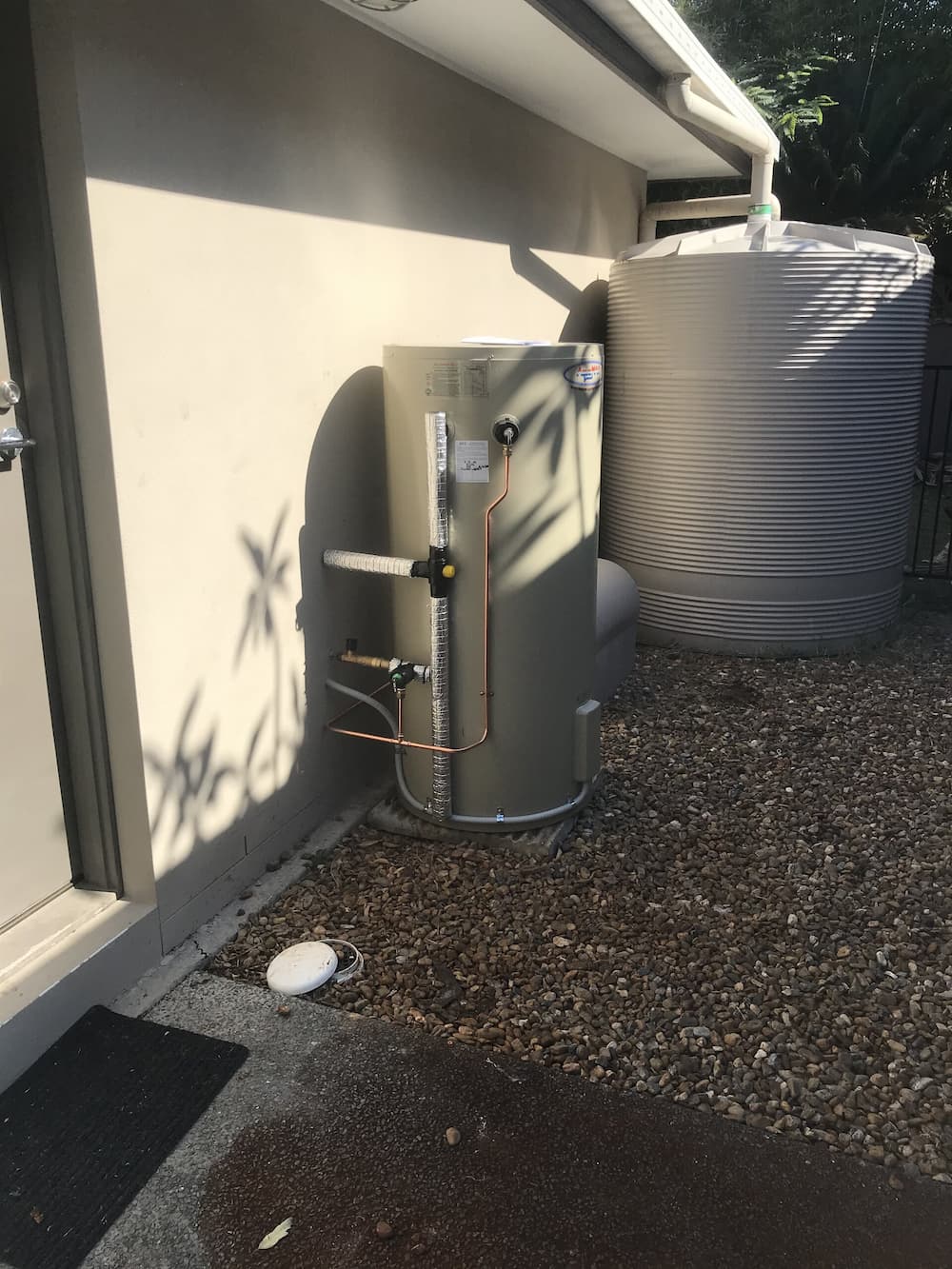 Hot Water System Installed in the Backyard — Rossi Plumbing in Gold Coast, QLD
