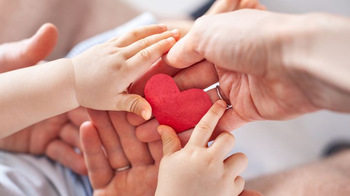 Golden cross floating on blue water.