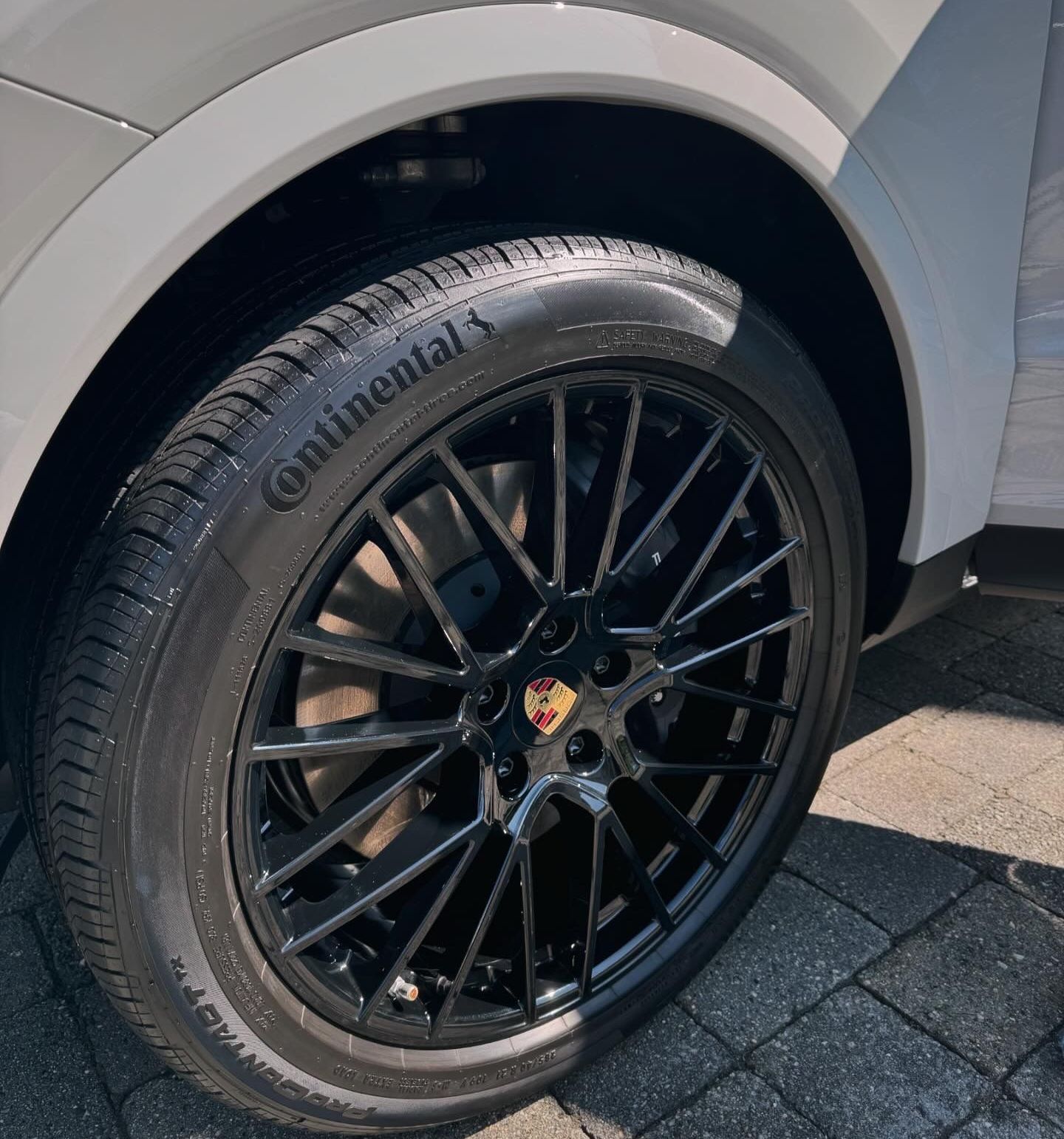 A close up of a continental tire on a car.