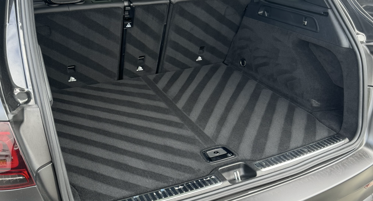 A close up of the trunk of a car with a striped pattern.