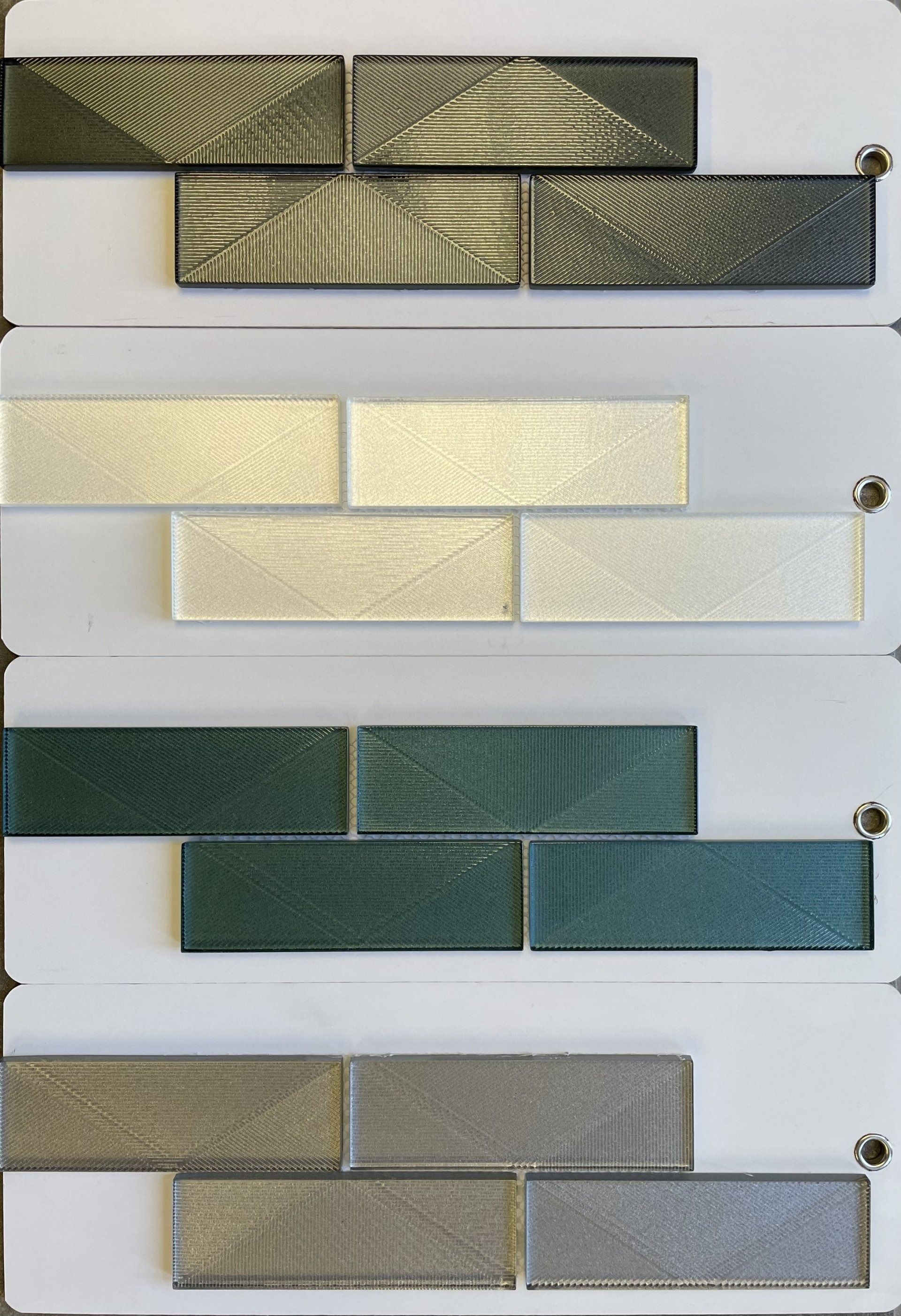 Stacked sample fabric swatches in olive, cream, teal, and gray with textured patterns.