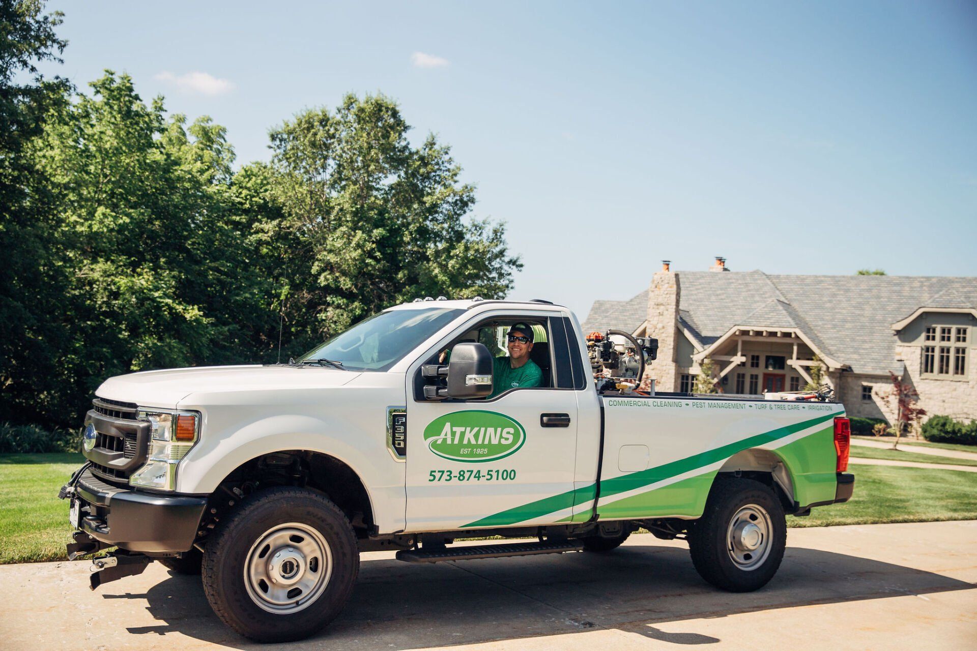The Atkins Truck on Their Way to Provide Lawn Care, Pest Control & More to Mid-Missouri Homes.