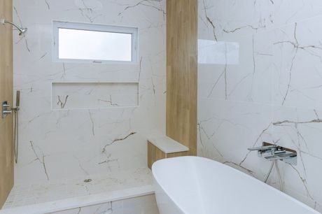 a bathroom with marbled wall