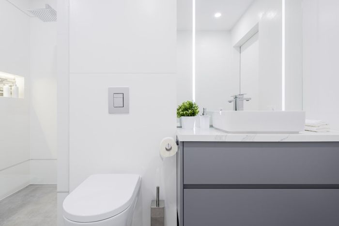 SIMPLE CLEAN BATHROOM WITH GREY DRAWERS