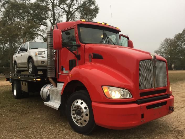 tow truck hauling suv