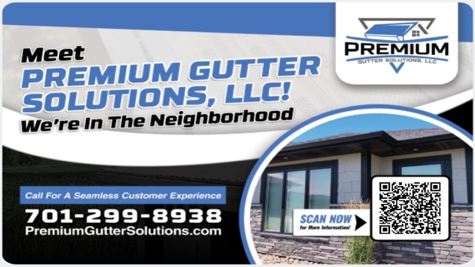 Electrician in hard hat and safety vest working on electrical panel, using a pen.