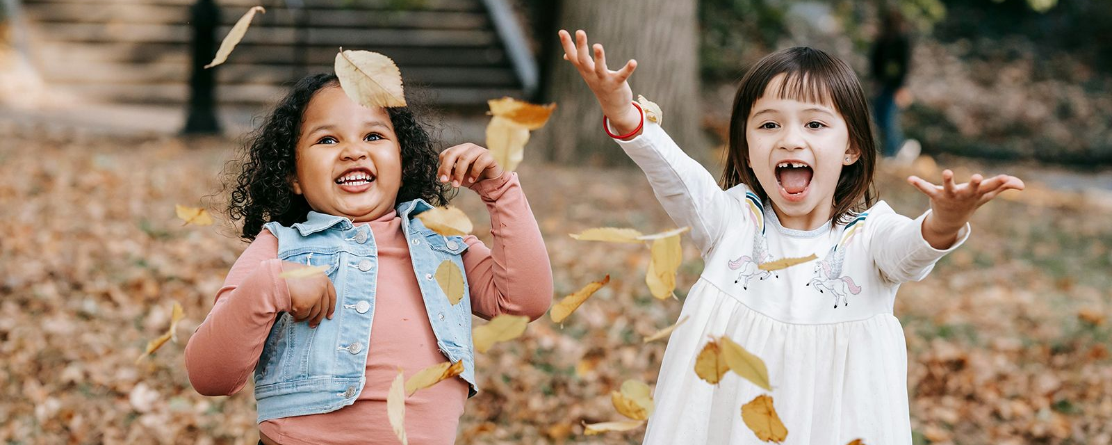 Girls playing with leaves