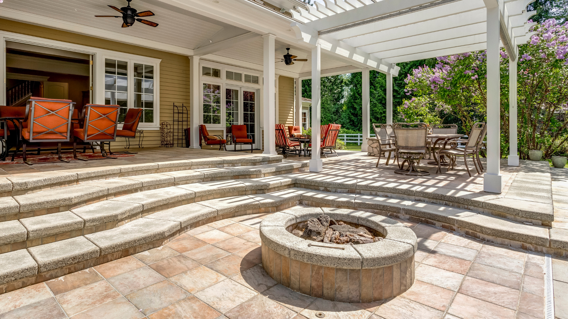 There is a fire pit in the middle of the patio.
