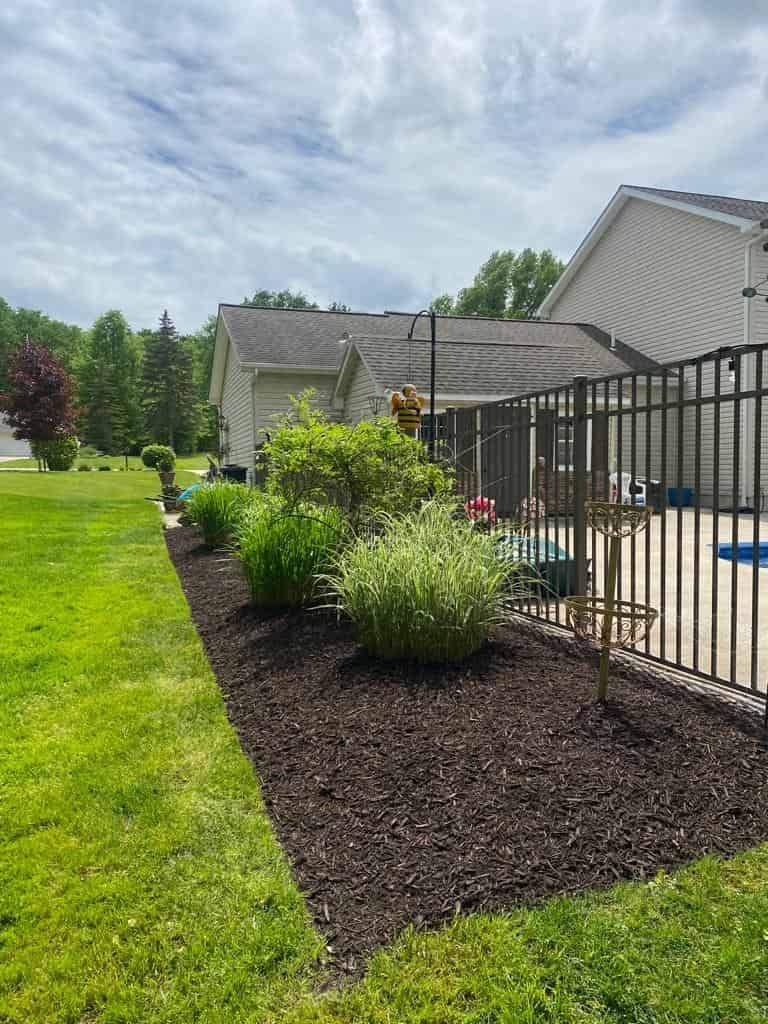 Fence with Lush Green Yard — Erie, PA — Saldana Services LLC