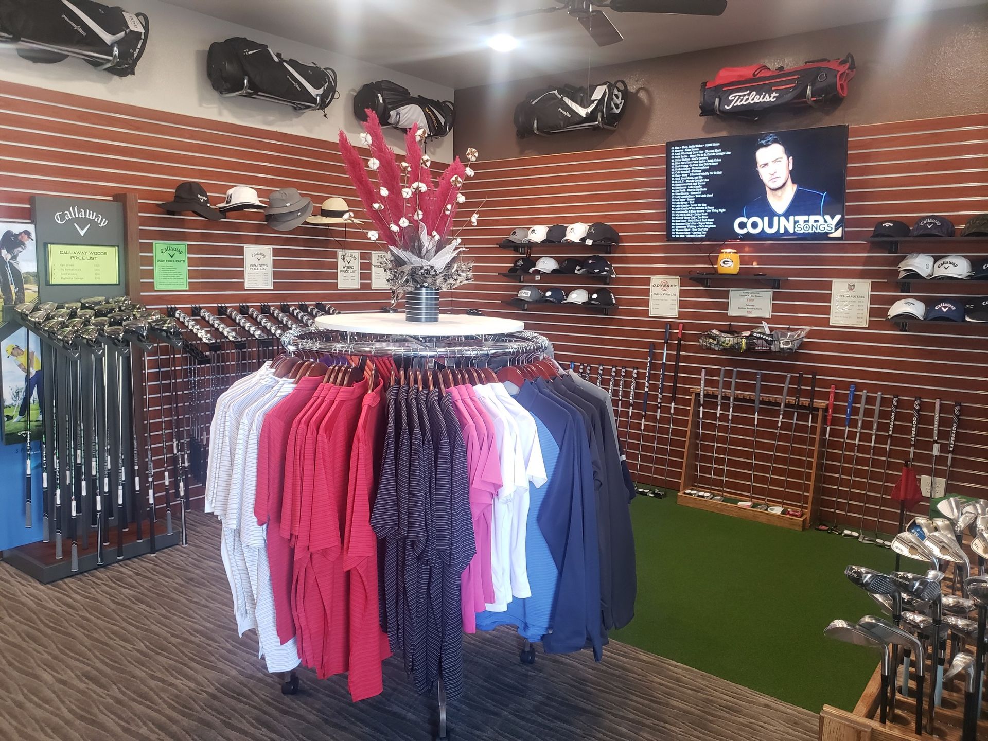 A store filled with lots of clothes and golf clubs.