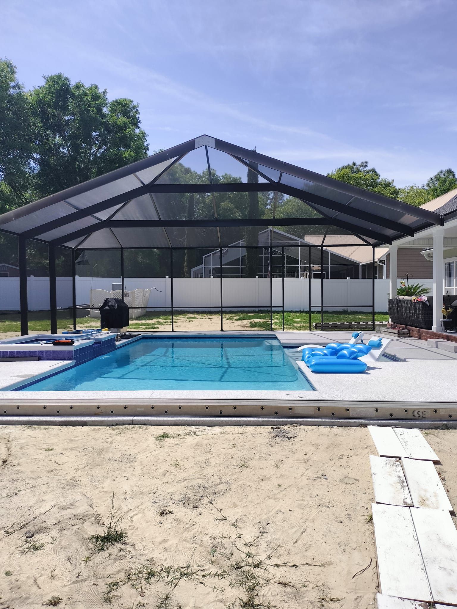 A large swimming pool with a canopy over it